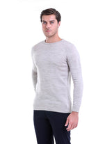 A light gray, long-sleeved crewneck sweater with a subtle heathered texture and ribbed cuffs.