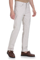 Beige chino trousers with a classic five-pocket design and subtle stitching details.