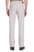 Beige chino pants with a straight-leg cut and brown leather brand patch at the waistband.
