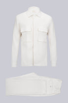 White cotton shirt with two front flap pockets and a classic collar.
