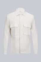 A crisp white, long-sleeved button-up shirt with a classic collar and two front patch pockets.