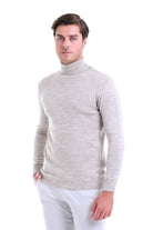 A light gray, textured knit turtleneck sweater with ribbed cuffs and hem.
