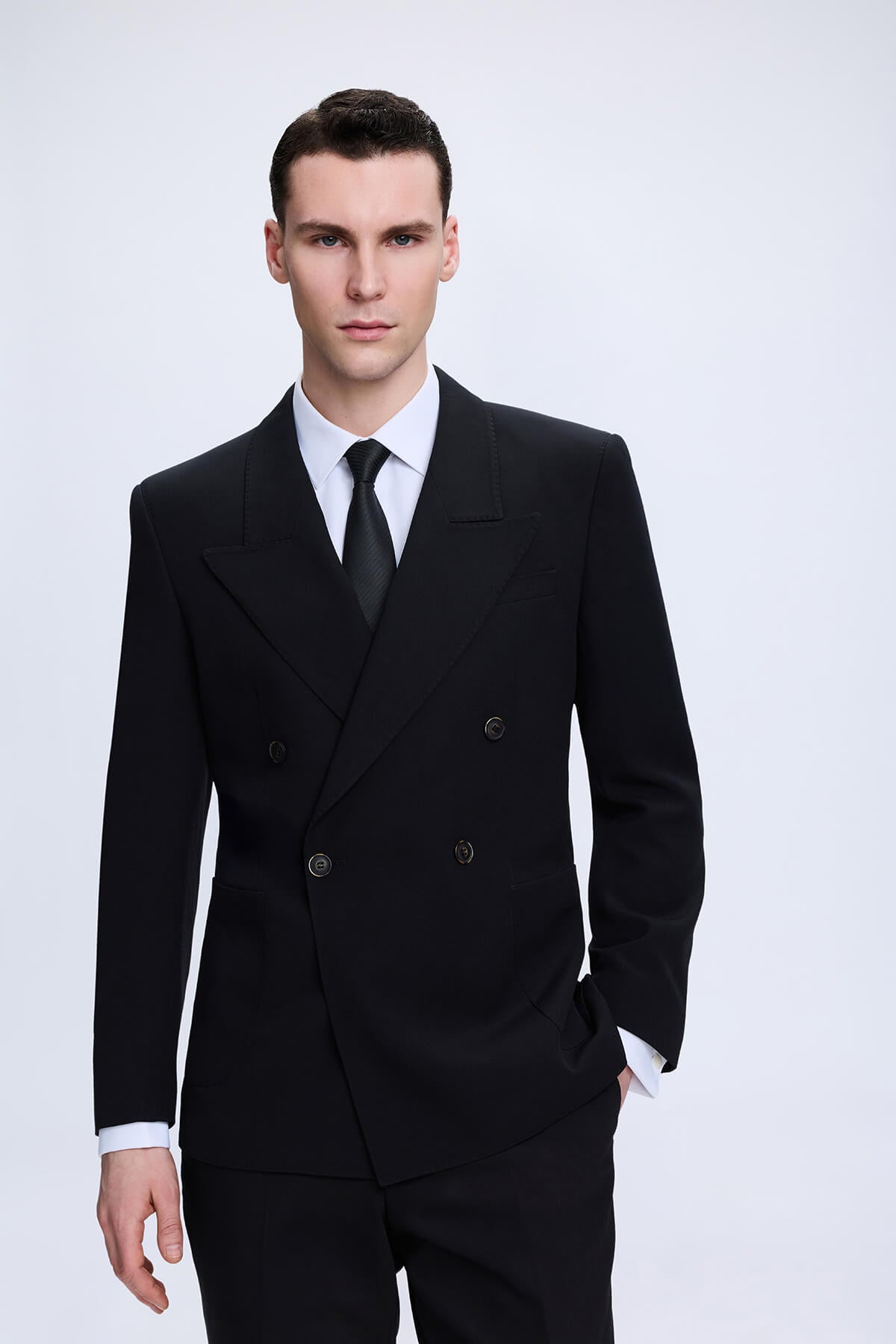 Regular fit black peak lapel double-breasted suit jacket with notched lapels and matching trousers in classic style