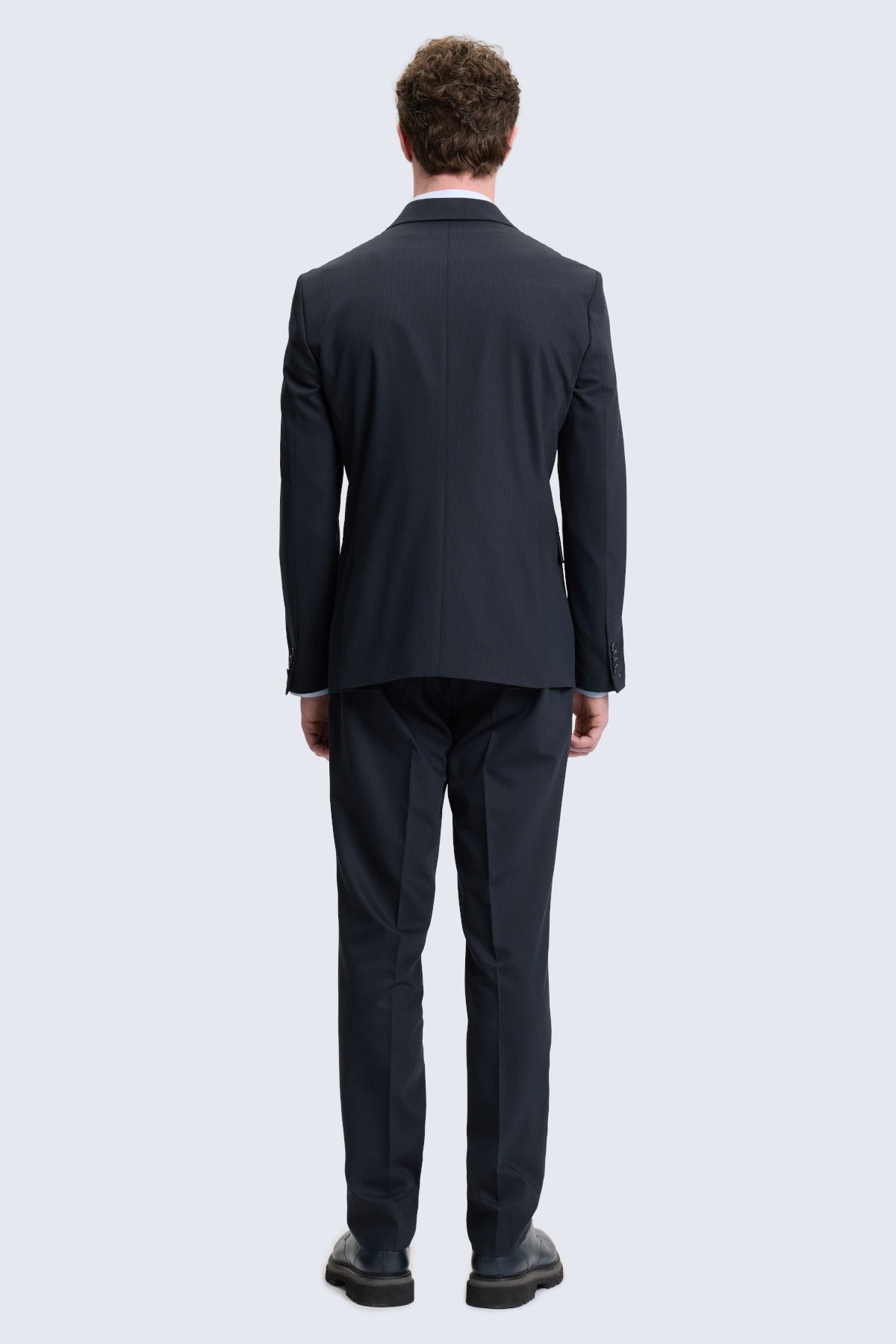 Regular fit black peak lapel double-breasted suit with sleek modern cut and subtle texture tailored for classic style