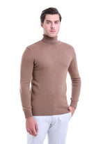 Beige turtleneck sweater with a textured knit pattern.