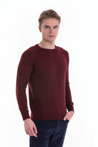 A maroon ribbed knit sweater with a crew neckline and long sleeves.