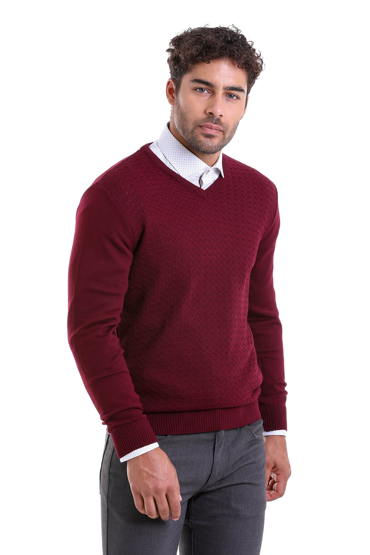 Maroon v-neck sweater with ribbed cuffs and hem.