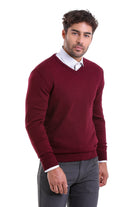Maroon v-neck sweater with ribbed cuffs and hem.