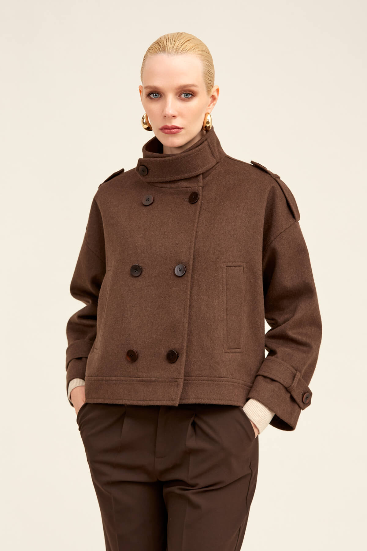 Brown wool double-breasted coat with a high collar and dark buttons.