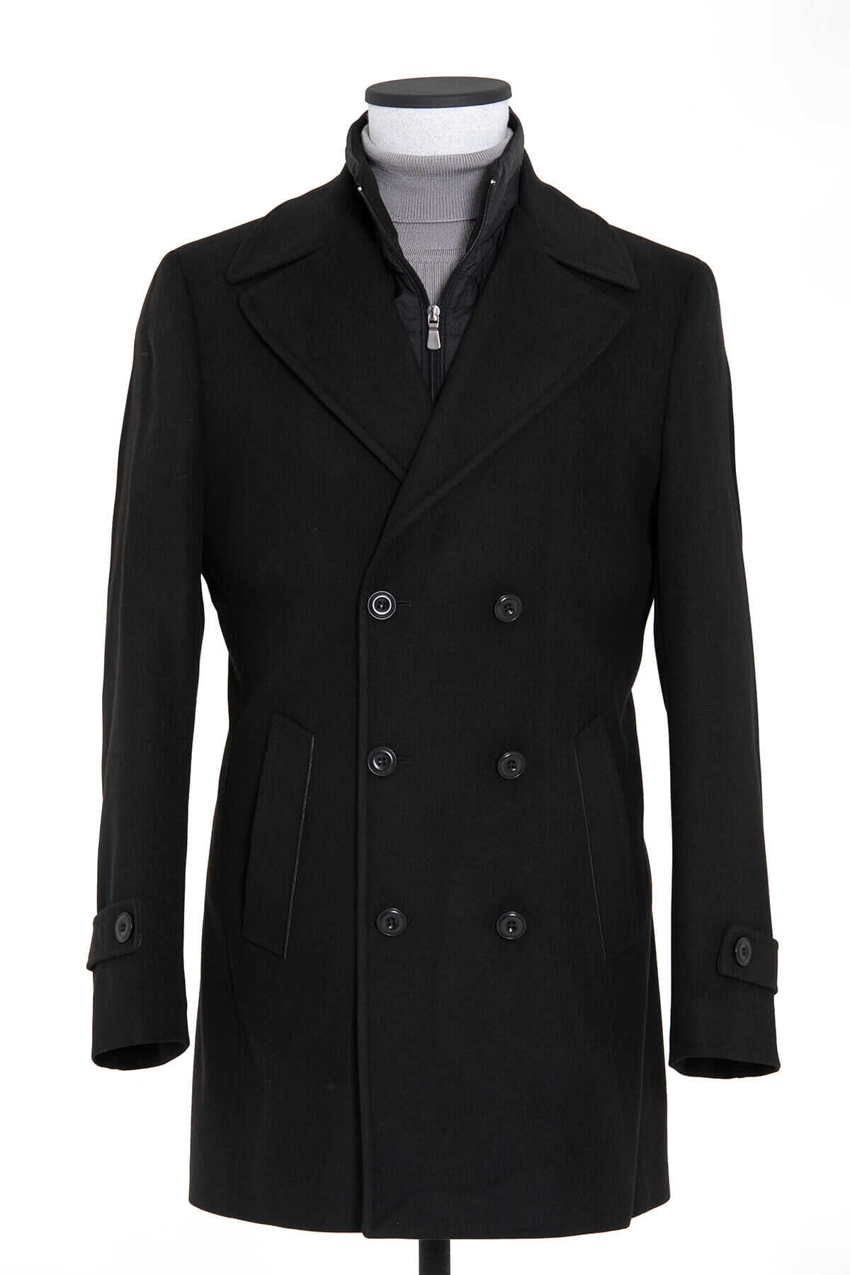 Black double-breasted wool overcoat with notched lapels and dark buttons.