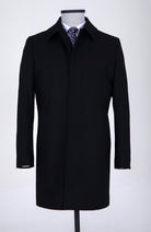 Black wool overcoat with notched lapels and a single-breasted design.