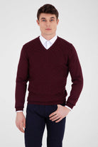 Maroon v-neck sweater with ribbed texture and white cuffs.