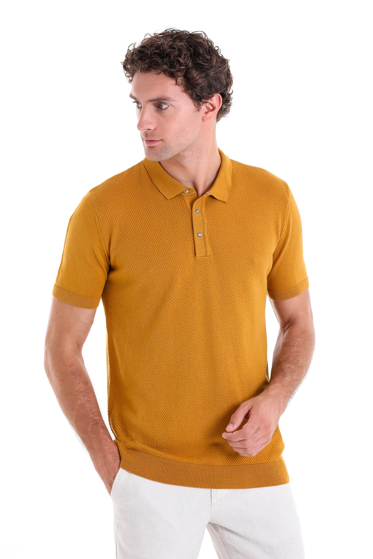 A mustard-yellow textured knit polo shirt with a classic collar and short sleeves.