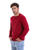 A rich red, long-sleeved crewneck sweater with a soft knit texture.