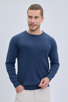 Navy blue regular fit cotton crewneck sweater with ribbed cuffs and hem perfect for casual wear