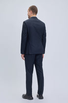A sleek navy blue regular fit double breasted suit with peak lapel and subtle texture in classic style