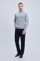 A man wearing a regular fit gray turtleneck sweater made of textured knit with ribbed cuffs and hem