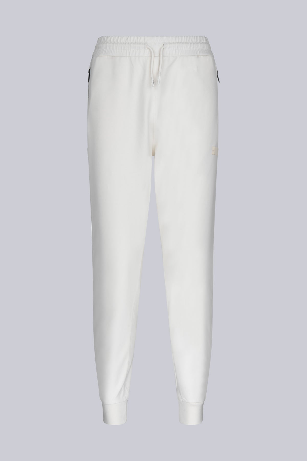 White cotton joggers with elastic waistband and drawstring, featuring subtle side pockets.