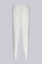 White cotton joggers with elastic waistband and drawstring, featuring subtle side pockets.