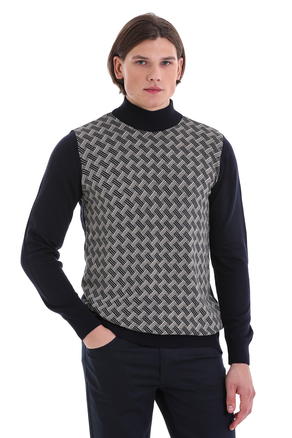 Black and gray geometric-patterned knit vest worn over a black turtleneck.