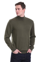 Olive green turtleneck sweater with ribbed cuffs and hem.