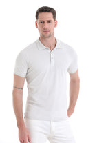 White short-sleeved polo shirt with a classic collar and subtle brand logo on the chest.