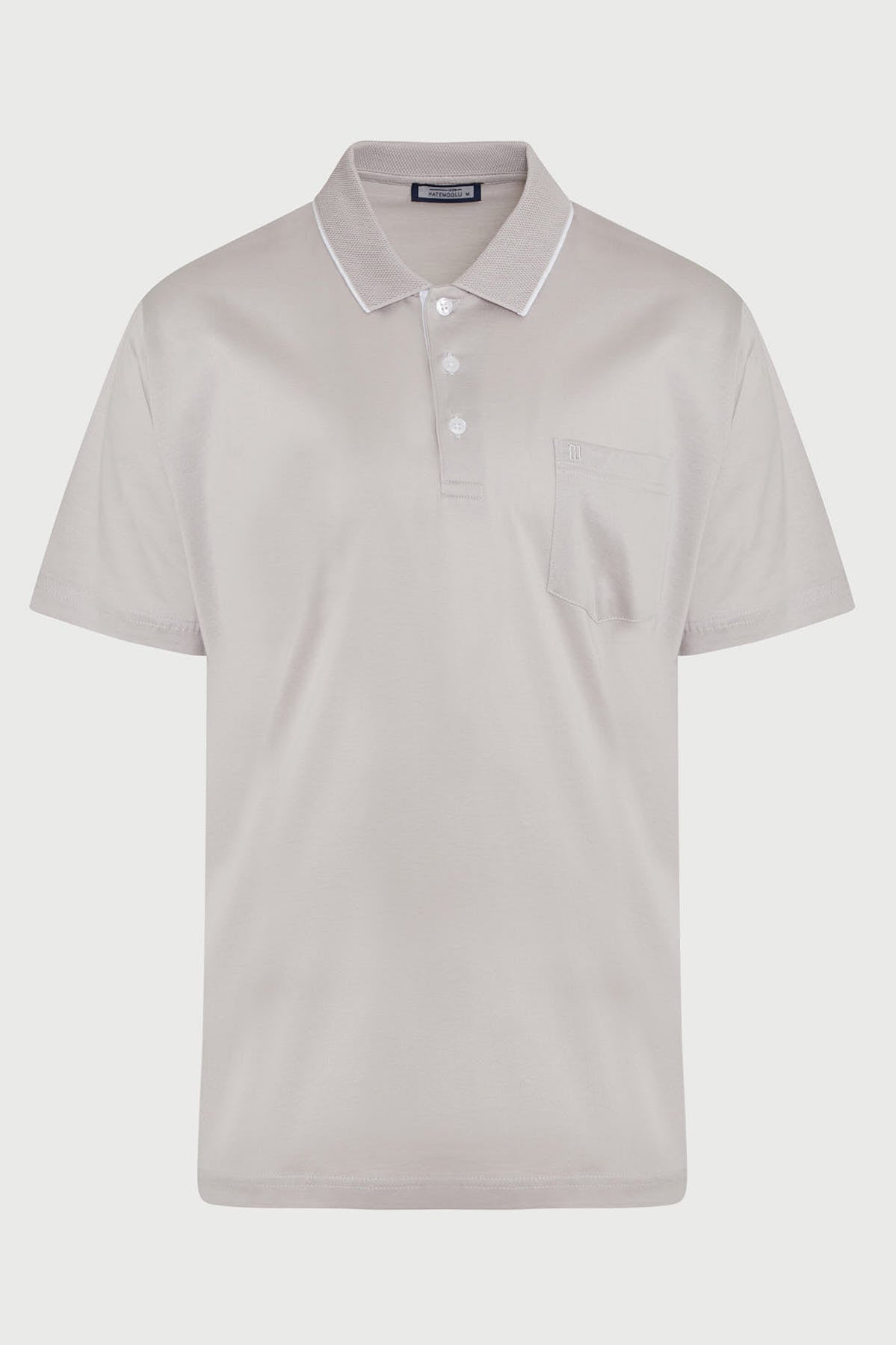 A light gray short-sleeved polo shirt with a subtle textured fabric, white trim along the collar and placket, and a single chest pocket.