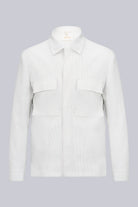 A crisp white corduroy shirt with a classic collar and two flap pockets on the chest.