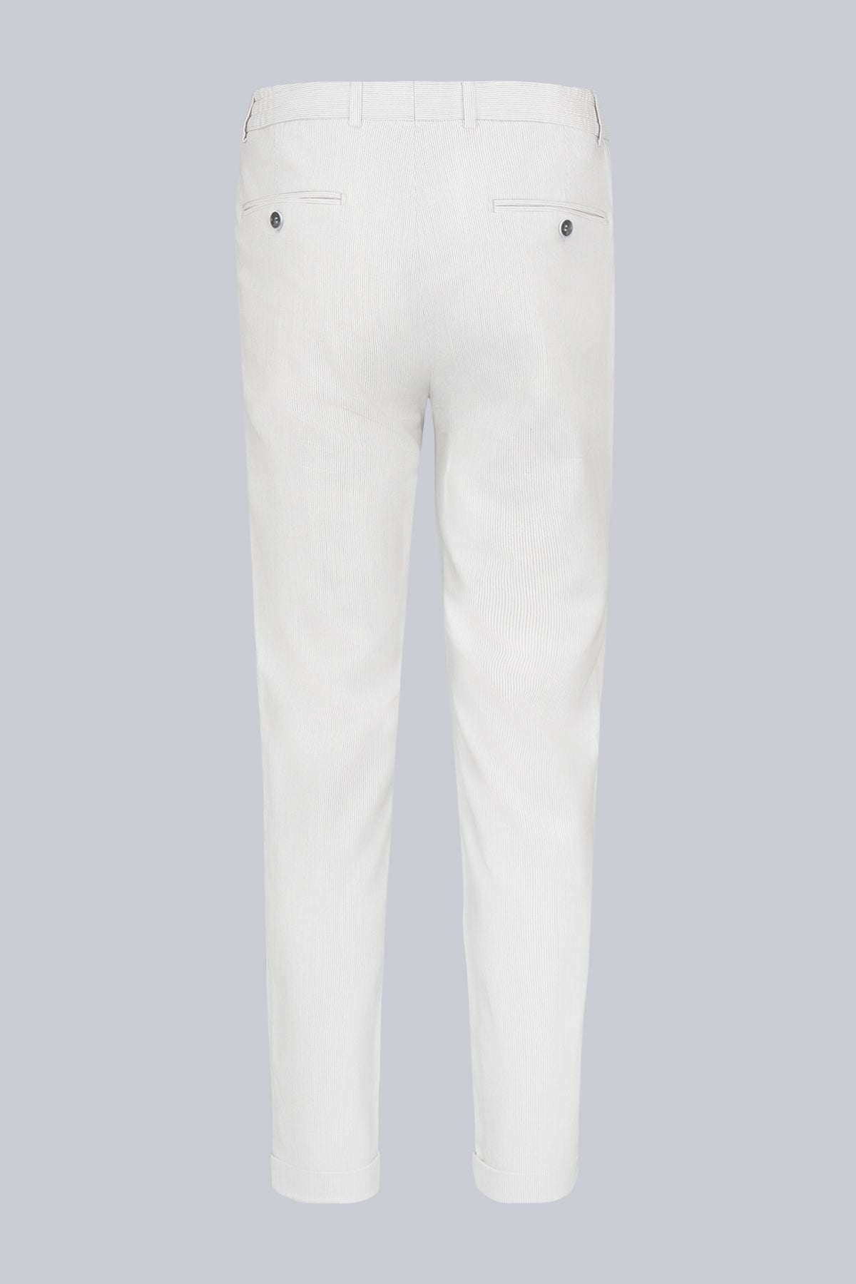 White corduroy trousers with a slim fit and subtle vertical ridges.