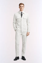 Model wearing a regular fit light gray pinstripe linen-blend casual suit with chest pockets and matching trousers