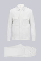 White linen shirt with two chest pockets and a classic collar.