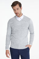 A light gray, textured v-neck sweater with ribbed cuffs and hem.