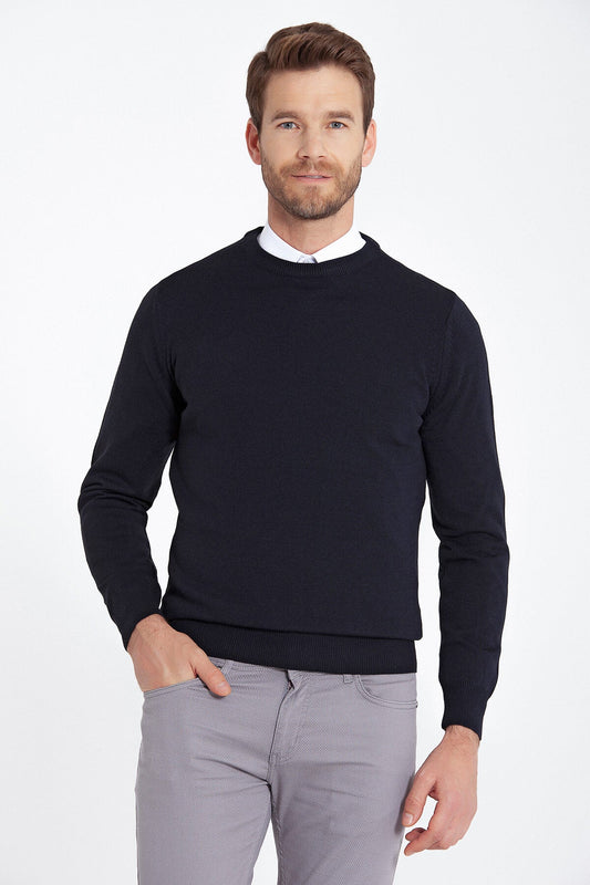 Black crewneck sweater with ribbed cuffs and hem.