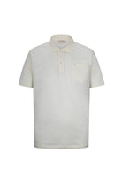 Cream-colored short-sleeved polo shirt with a classic collar and chest pocket.