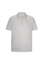 A crisp white short-sleeved polo shirt with a subtle contrast trim along the collar and placket.