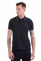 Black short-sleeved polo shirt with white trim on the collar and sleeve cuffs, featuring a small embroidered logo on the left chest.