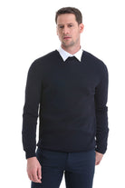 Black crewneck sweater with a subtle ribbed texture and neatly folded collar.