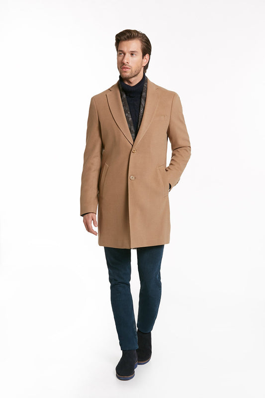 A tailored camel-colored wool overcoat with a notched lapel and two front buttons.