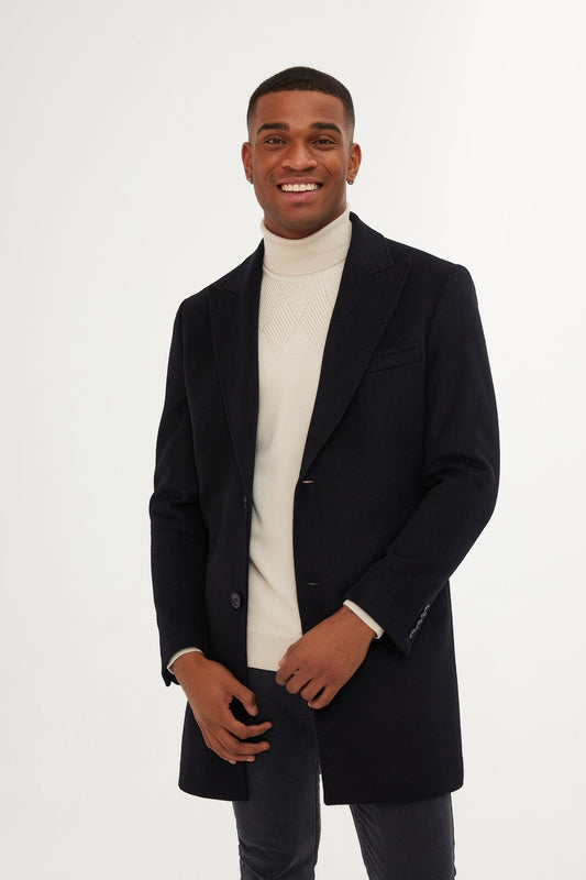 Black wool overcoat with notched lapels and double-breasted buttons.