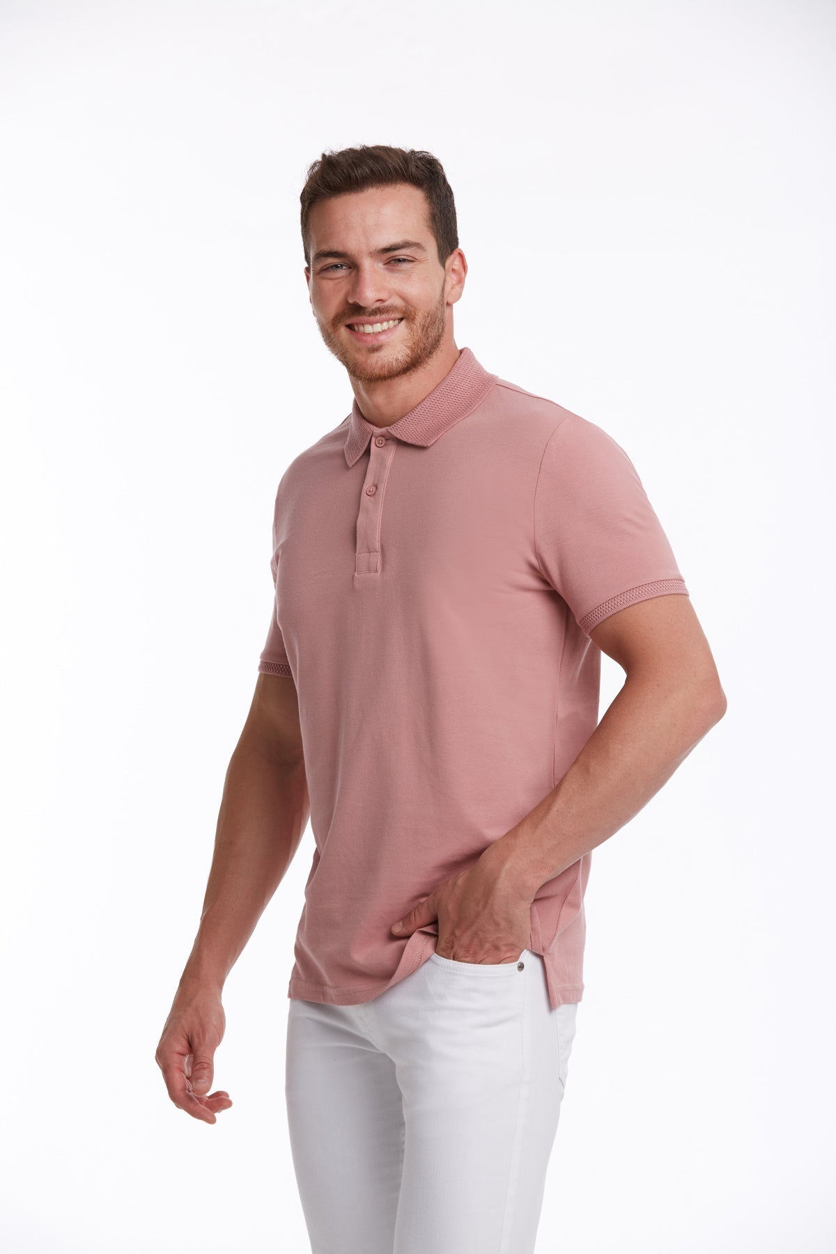 A soft pink short-sleeved polo shirt with a classic collar and buttoned placket.