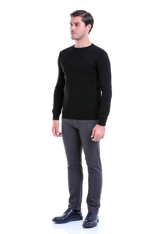Black long-sleeved knit sweater with a crew neck.