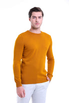 A men’s mustard-yellow crewneck sweater with ribbed cuffs and hem.