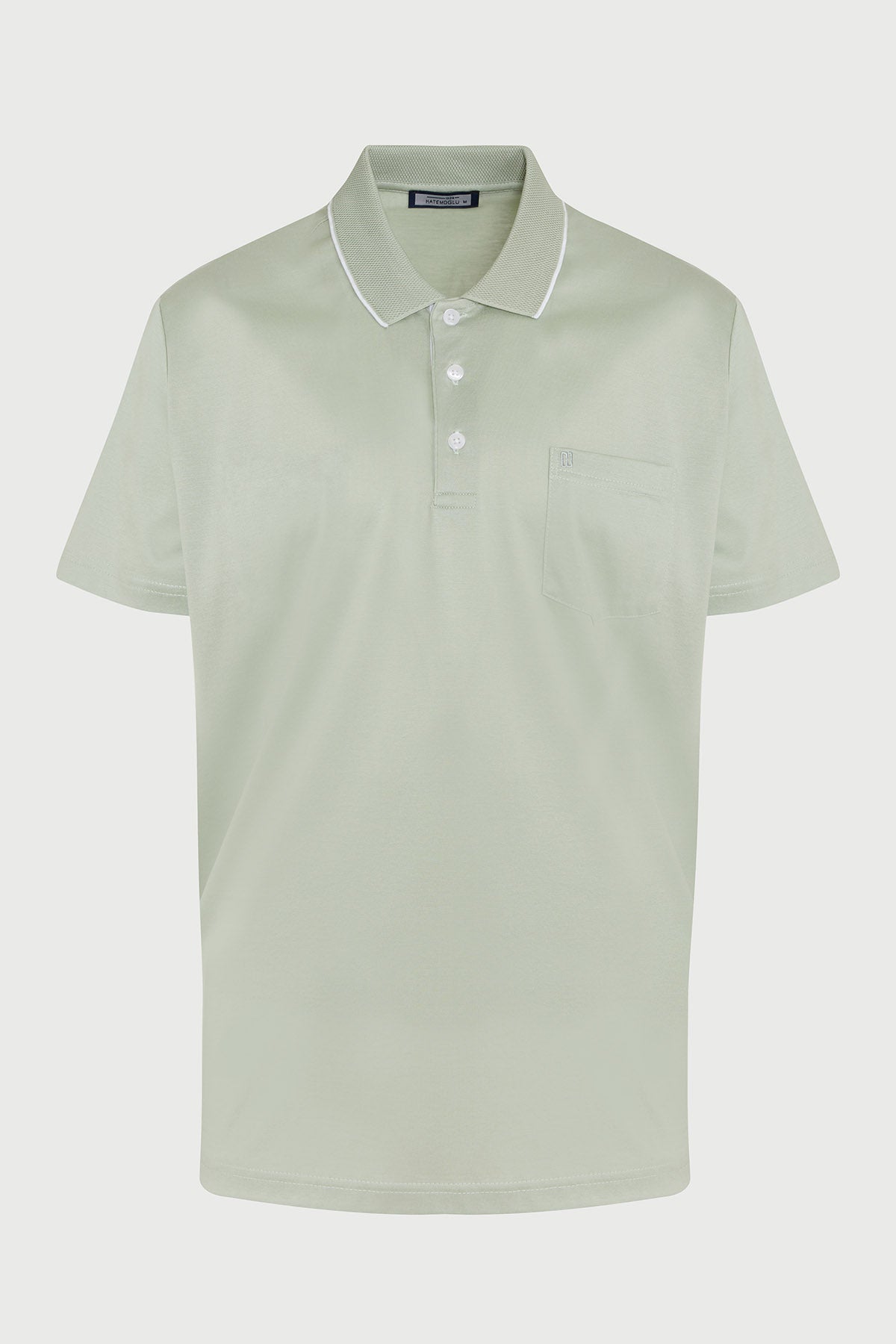 A light green short-sleeved polo shirt with a white trim collar and button placket.