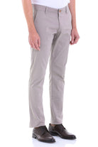 Khaki-colored, slim-fit chino trousers with a classic belt loop design and matching button closure.