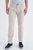 Beige chino trousers with a classic fit and subtle creases.