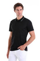 Black short-sleeved polo shirt with white trim along the collar and placket.