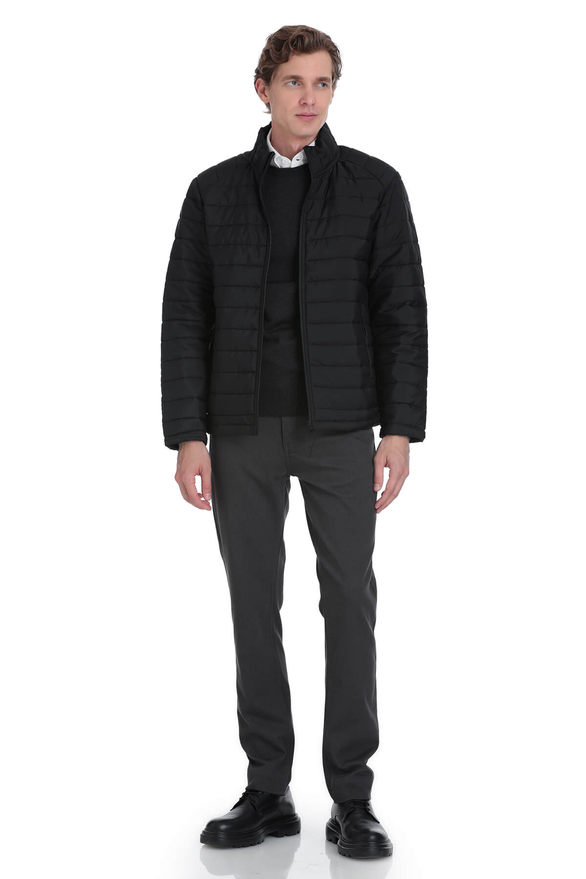 Black quilted puffer jacket with a high collar and zipper closure.