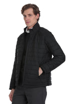 Black quilted puffer jacket with a high collar and front zipper.