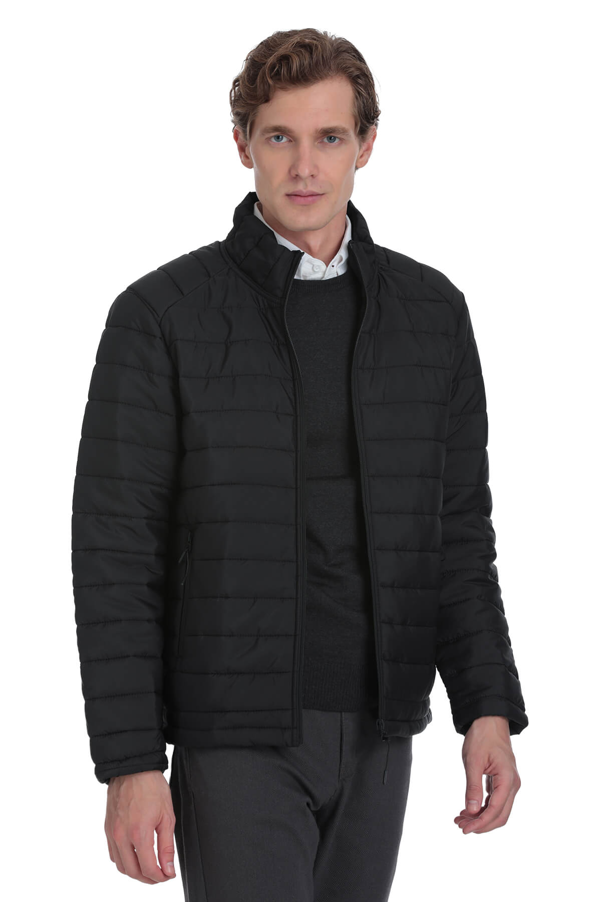 Black quilted puffer jacket with a stand-up collar and zipper closure.