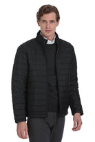 Black quilted puffer jacket with a stand-up collar and zipper closure.